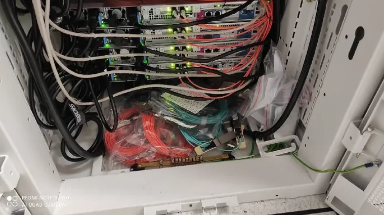 A patch panel with structured cabling terminated and labelled